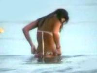 Daniela Cicarelli is fooling around with her man on the beach.