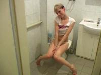 Charming teen blonde filmed stripping and pissing