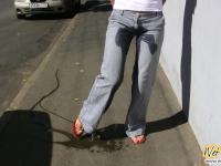 Jeans wetting and removing in the street