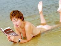 Watch her bathe her amazing teen body in the water