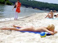 The water feels good on these nudist's bare skin