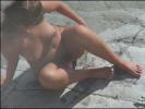 Fired-up bubbleable slut polishes the cock on a beach