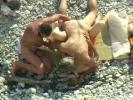 Two males and a girl have some bisexual beach fun