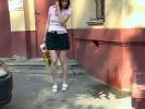Babe relieves herself in skirt in public