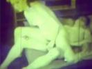 A burglar enters a house where a woman is just putting her stockings on. A little later the guy is naked and laying down on the bed while the woman is fucking him. Then she jerks him off until he comes on her hairy pussy.