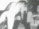 A naked guy is laying on the bed while a blonde girl is giving him a massage. Another girl leans over him to suck his dick. A little later he is fucking one of the girls from behind until he comes on the other girls boot.