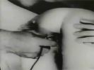 In this movie from 1926 a naked couple is in front of the camera. The woman is on her knees and the guy fucks her ass from behind. A little later he sticks a finger up her asshole, replacing it later on with a lighbulb.
