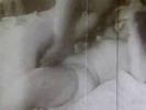 In this vintage black and white movie there are two women and a man in a room. The man takes one of the girls into the bedroom. he both of them undress and fuck together on the bed while the second girl waits for them in the living room.