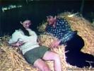 A couple is laying in the haystack in a barn. The guy is touching the girl up, licking her tits. Then she gives him a blow job until the farmer and his wife come in. At first they are angry but they end up in a foursome.