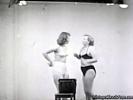 In this vintage movie we see two girls in bikini fighting with each other in a studio. They try to wrestle each other to the floor. In the second part we see two female wrestlers fighting each other in the ring.