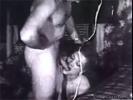 In this classic porn movie we see a woman giving a guy a blow job, licking his balls and the length of his shaft. They then join another couple which is already fucking on the bed.
