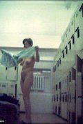 Sexy lady bares it all in a public locker room