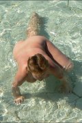 Nude chicks bask in the sun unsuspecting of filming
