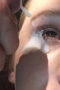 A teen chick takes a salty cumshot in the eye