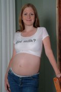 Young pregnant model bares it all in front of the camera to pleasure her pussy with a dildo