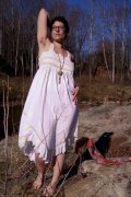 Lara - Mature, curvy brunette with full bush and thick pit hair strips outdoors.